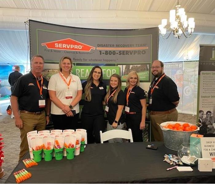 SERVPRO staff at event in front of booth